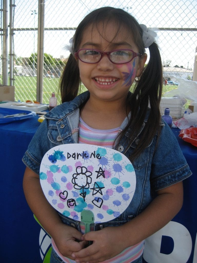 A. 4 yo smiling with art